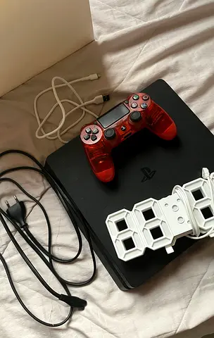 PlayStation 4 slim , with controller, and with charger , and digital clock 3D