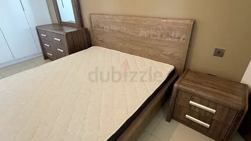Queen wooden bed frame with mattress and bedside tables - like new