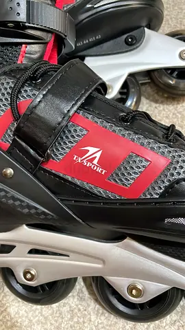 Pair of black inline rollerblades, used, adjustable straps