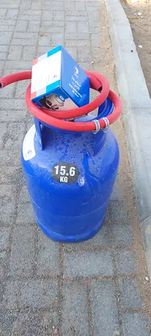 New empty Gas cylinder with regulator hose pipe clam