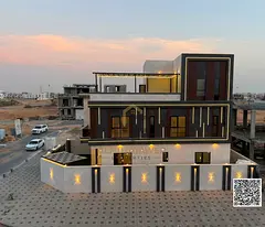 Luxury corner villa for sale in Ajman, including registration, electricity, and water. Prime locatio