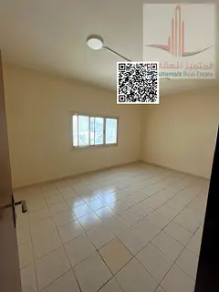 Two-bedroom apartment with a living room and central air conditioning in Al Nuaimiya 1.
