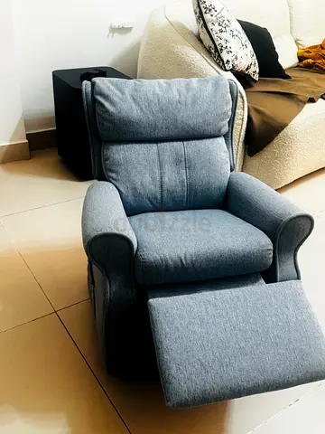 Comfortable grey fabric recliner chair with footrest for children