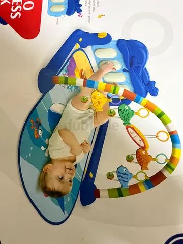 Baby play gym with piano and hanging toys - lightly used