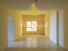In Emirates City, Ajman, a spacious two-bedroom apartment with a huge balcony and podium view is ide