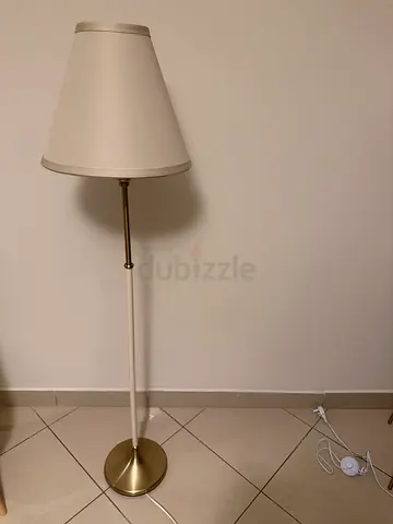 Simple white floor lamp with brass base — good condition