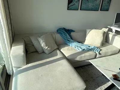 Light grey L-shaped fabric sofa with chaise - good condition