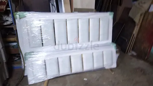 Pair of white interior doors (new, wrapped)