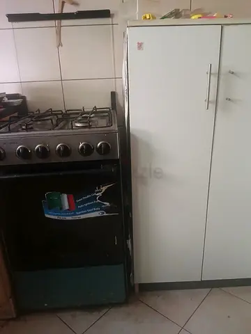 Cooking range with floor cabinets