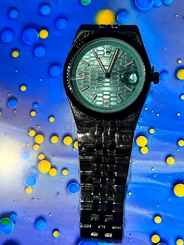 Pre-owned mens stainless steel wristwatch with patterned turquoise dial rolex