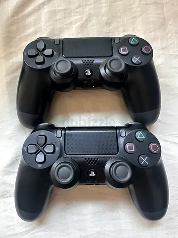 Pair of Black Sony DualShock 4 Controllers (PS4) - Good Working Condition