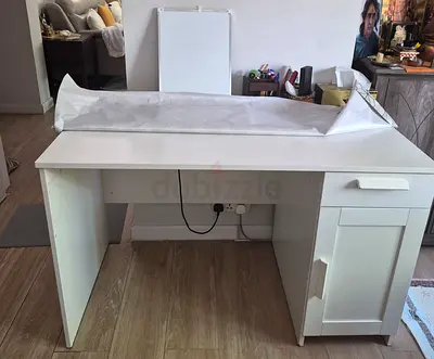 White single-drawer study desk (Dhs 400) and  dining table without chairs (Dhs500)- good condition