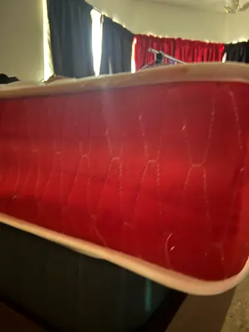 Single mattress in good used condition - red cover. King size 200 by 180