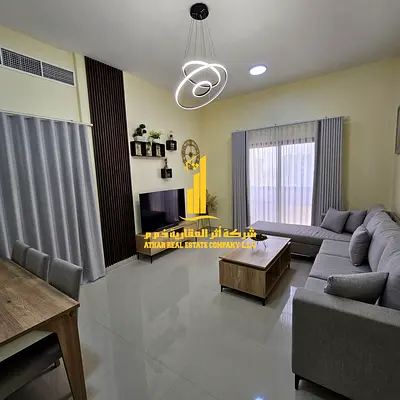 Beautiful one-bedroom apartment with an open view, fully furnished with new furniture, available for monthly rent in Ajman - Corniche.