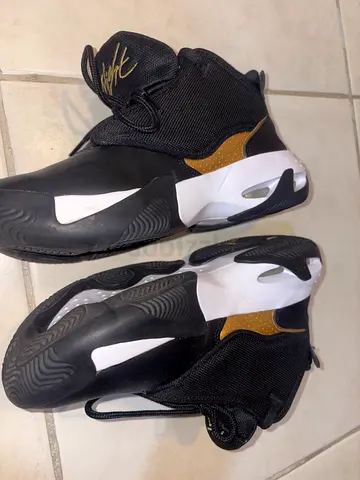Kids or women black and gold athletic sneakers, size 38.5