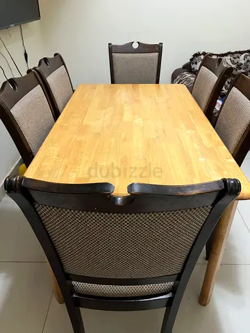 Wooden dining table with 6 upholstered chairs - good condition