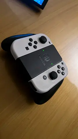 Nintendo Switch (handheld) with Joy-Con, grip, straps and game card - (gta) Good condition.