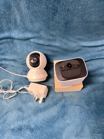Two home security cameras (indoor/outdoor) with power adapter