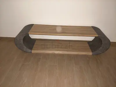 Modern oval wooden TV/entertainment unit with lower shelf