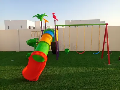 Outdoor kids playset with slide and swings - good condition