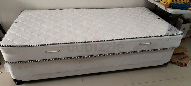Single bed with mattress and base on castors - good condition