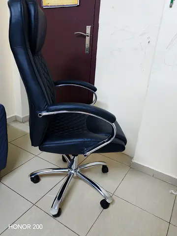 Black high-back ergonomic office chair with headrest