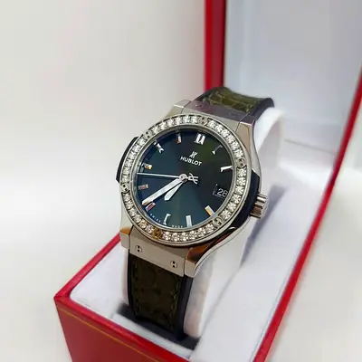 Hublot with diamond bezel, date, leather strap