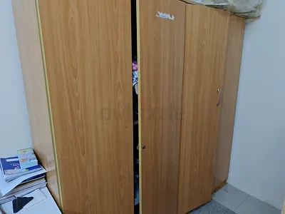 Two-door wooden wardrobe in good used condition