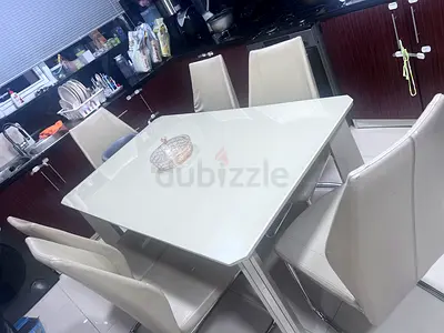 Beige Glass Top Dining Table with 6 Cream Leather Chairs