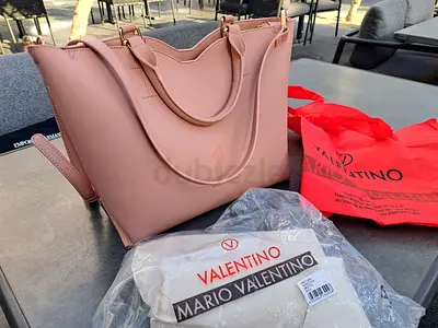 Mario Valentino pink bag with golden buckle, detactable strap,exclusive from europe available dubai.