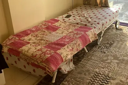 single folding guest bed with mattresses — good condition