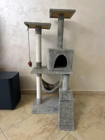 Grey multi-level cat tree with condo and scratch posts