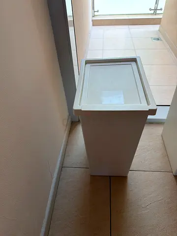 Small white plastic storage bin / trash can / laundry basket
