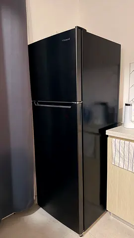Black top-freezer refrigerator - good condition