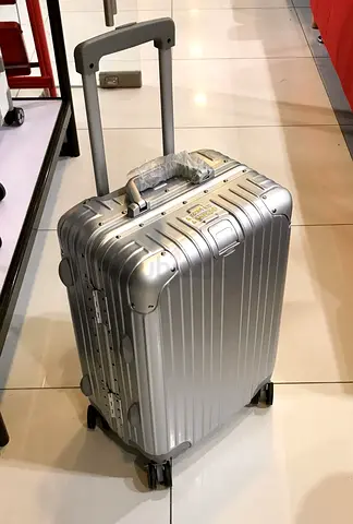 Rimowa Silver hard-shell spinner carry-on suitcase with telescopic handle