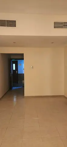 One-bedroom apartment with a living room in Garden City Towers,