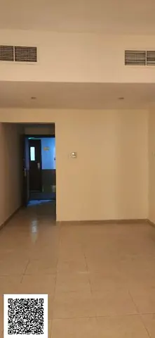 One-bedroom apartment with a living room in Garden City Towers,