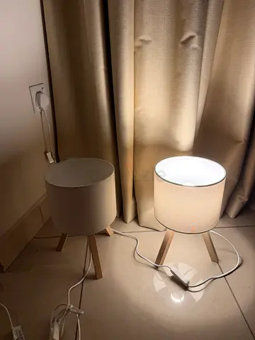 Pair of beige tripod table lamps with fabric shades