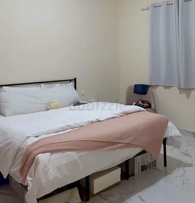 King metal bed frame with mattress and linens - good condition
