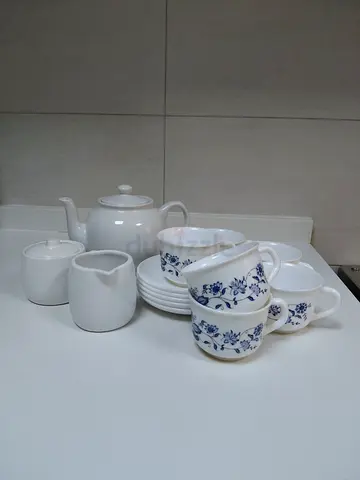 White porcelain tea set with blue floral pattern - teapot, cups, saucers, sugar  creamer