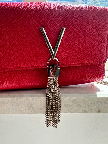 Red Valentino cross body bag with chain tassel