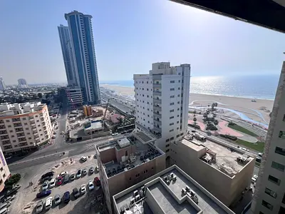 New building, first occupancy, two bedrooms, living room, 4 bathrooms, master bedroom, American kitchen, Ajman Corniche