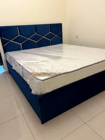 Blue Velvet Bed Frame with Patterned Headboard and Spring Mattress
