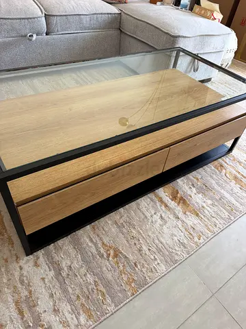 Wooden coffee table with glass top