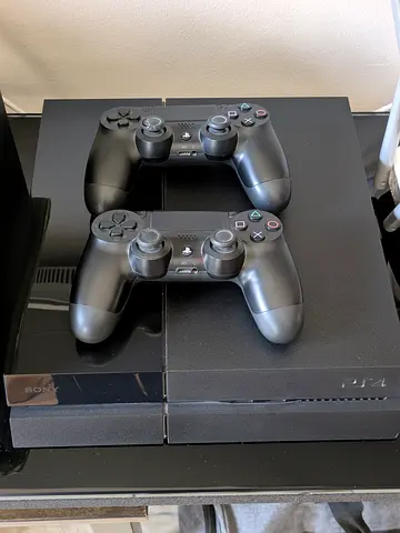 Sony PS4 with 2 DualShock Controllers + games