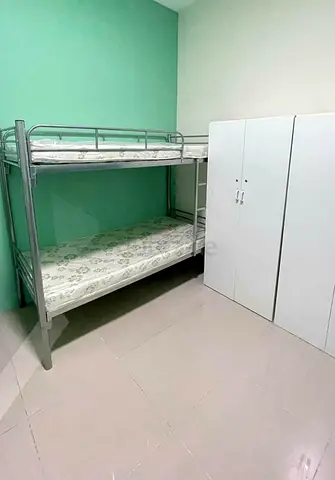 Metal Bunk Bed with Two Mattresses and White Wardrobe