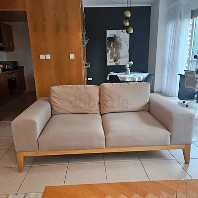 Light grey 2-seater sofa with wooden frame length 200 cms width 100 cms and height 85 cms