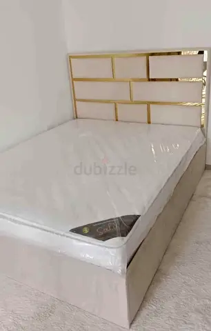 New Queen bed frame with gold-accent headboard and new mattress