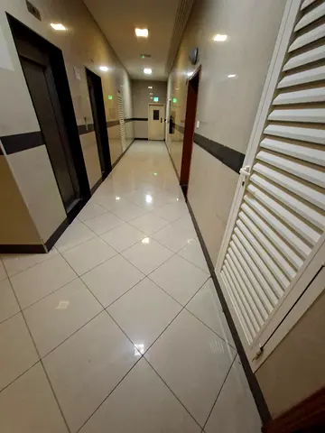 For rent in Sharjah Al Taawun two bedroom apartment with living room two master bedrooms three bathrooms two balconies central AC yearly rent 45000 AE