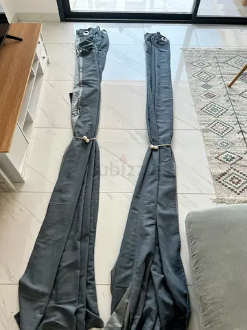 Pair of grey blackout curtains with eyelets - good condition. INCLUDES POLE!